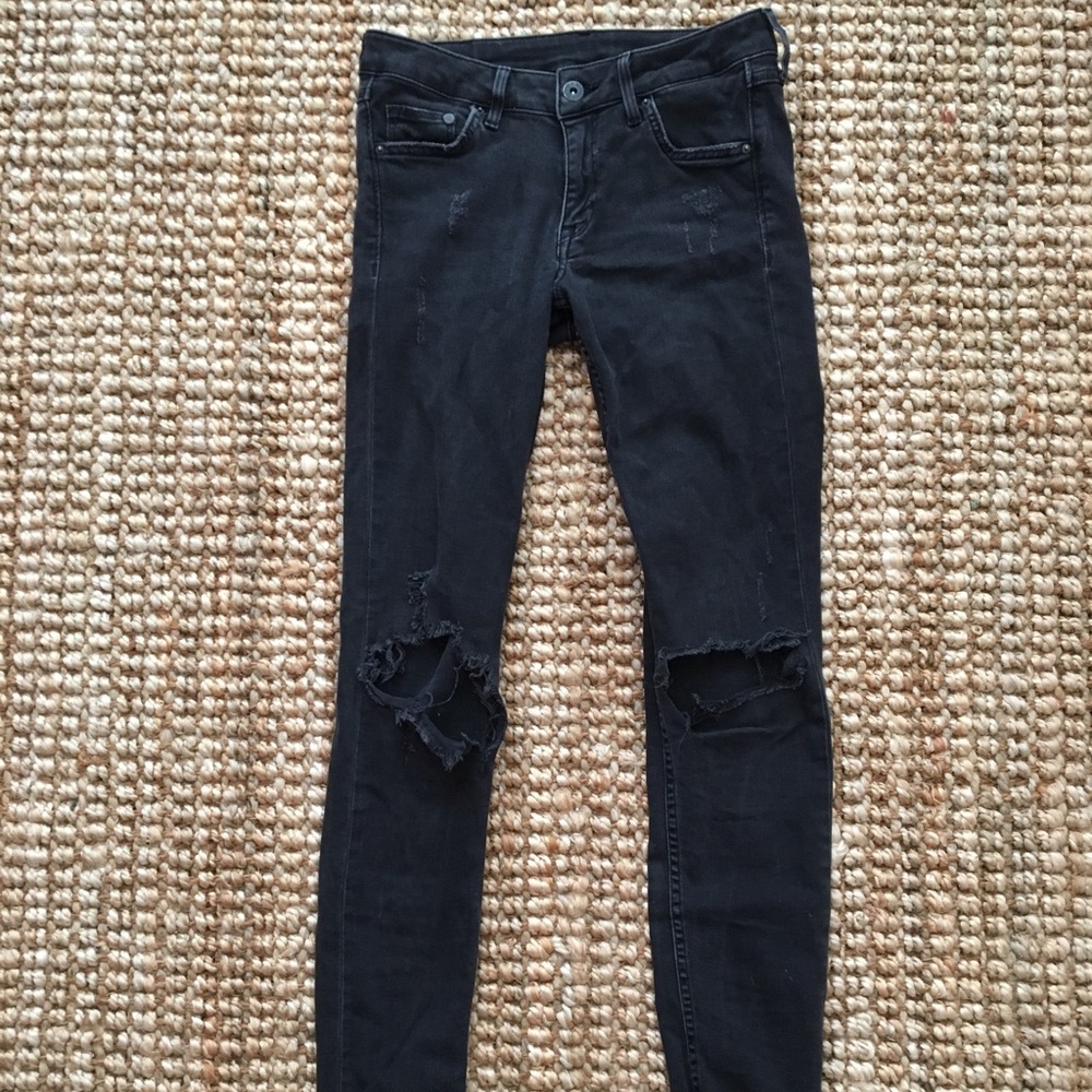 Stretchy black distressed denim